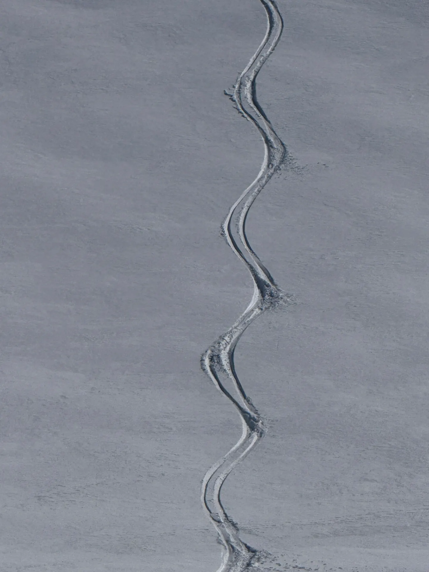 Heliski fresh powder tracks down an Andes face