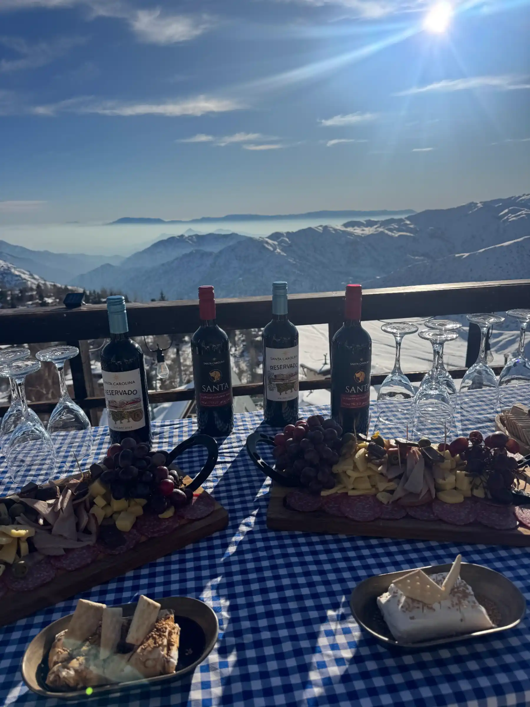 Wine, charcuterie and mountain view lunch on a sunny terrace at La Parva