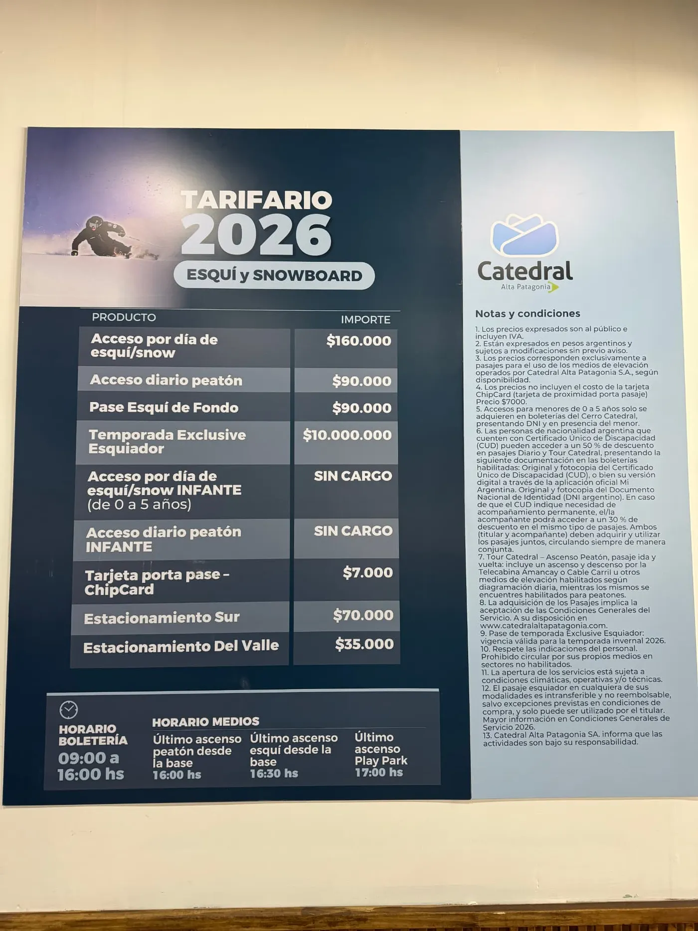 Cerro Catedral 2026 price board listing ticket products and prices in Argentine pesos, with ticket office and lift operating hours below