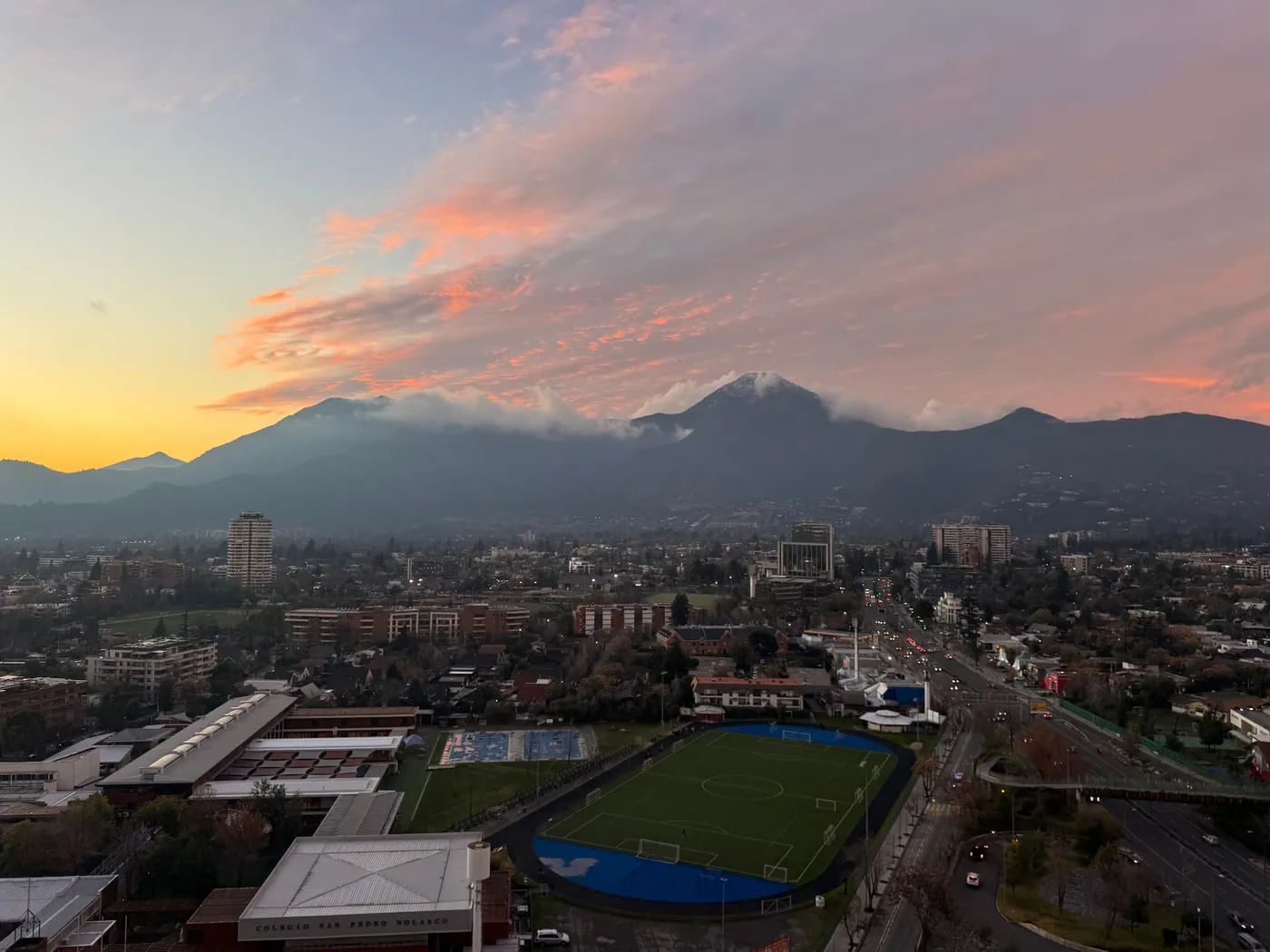 Sunset over Santiago, Chile, with the Andes foothills rising behind the city
