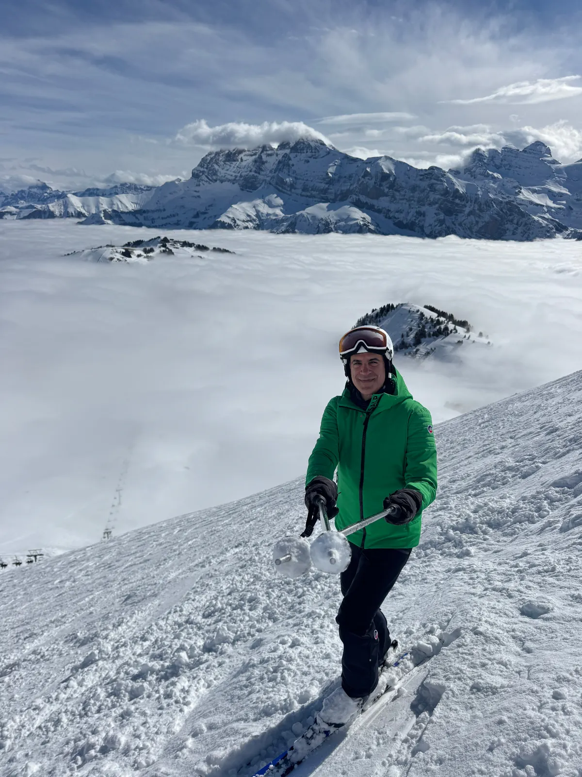 Khosro Ronagh, founder of YourSnowPlanner, skiing above the clouds in the South American Andes